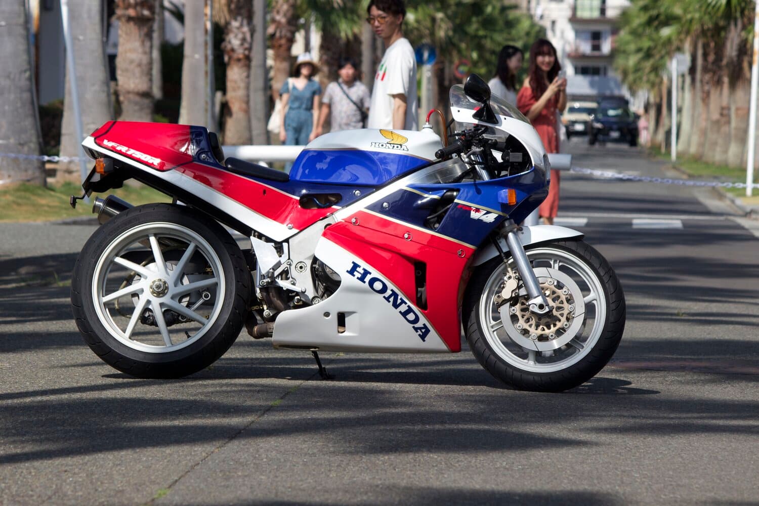 An image of a 1988 Honda RC30 VFR750 parked at Zushi marina in Japan.