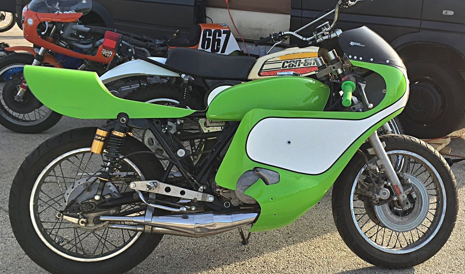 An image of a lime green 1974 Kawasaki S3 race replica