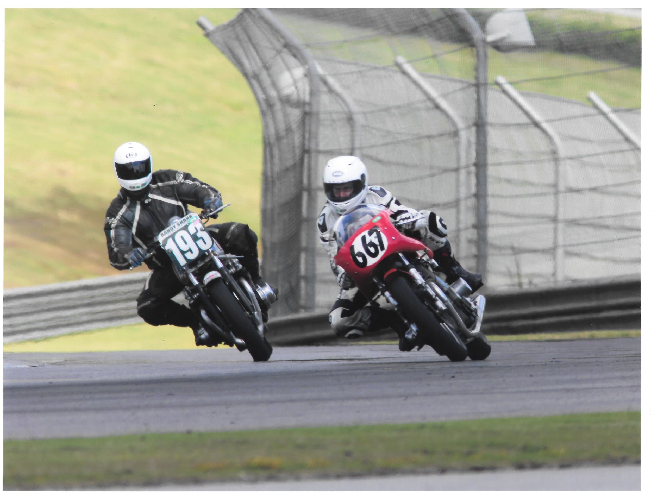 An image of Larry from New York City Motorcycles racing on a vintage Laverda motorcycle. He's leaning low into a corner.