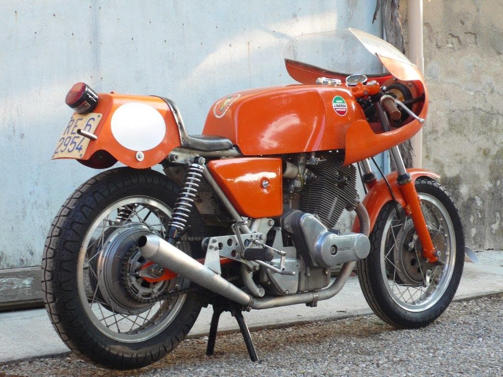 A photograph of an orange coloured vintage Laverda motorcycle.