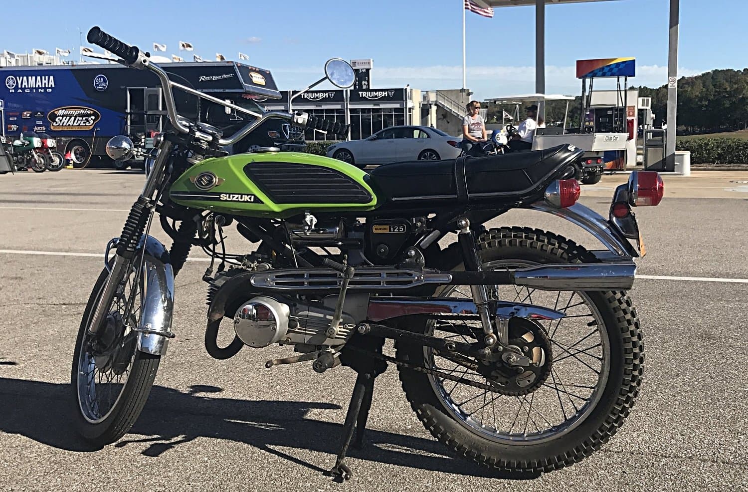 An image of a green 1971 Suzuki T125 Stinger